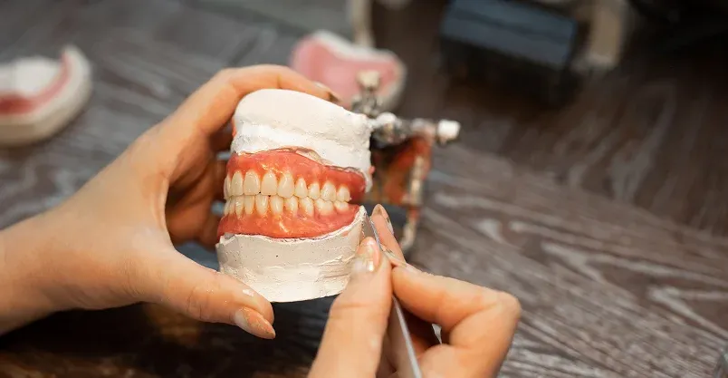 Happy patient pointing to smile