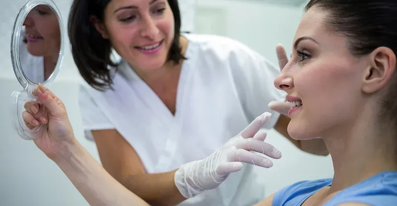 Happy patient pointing to smile